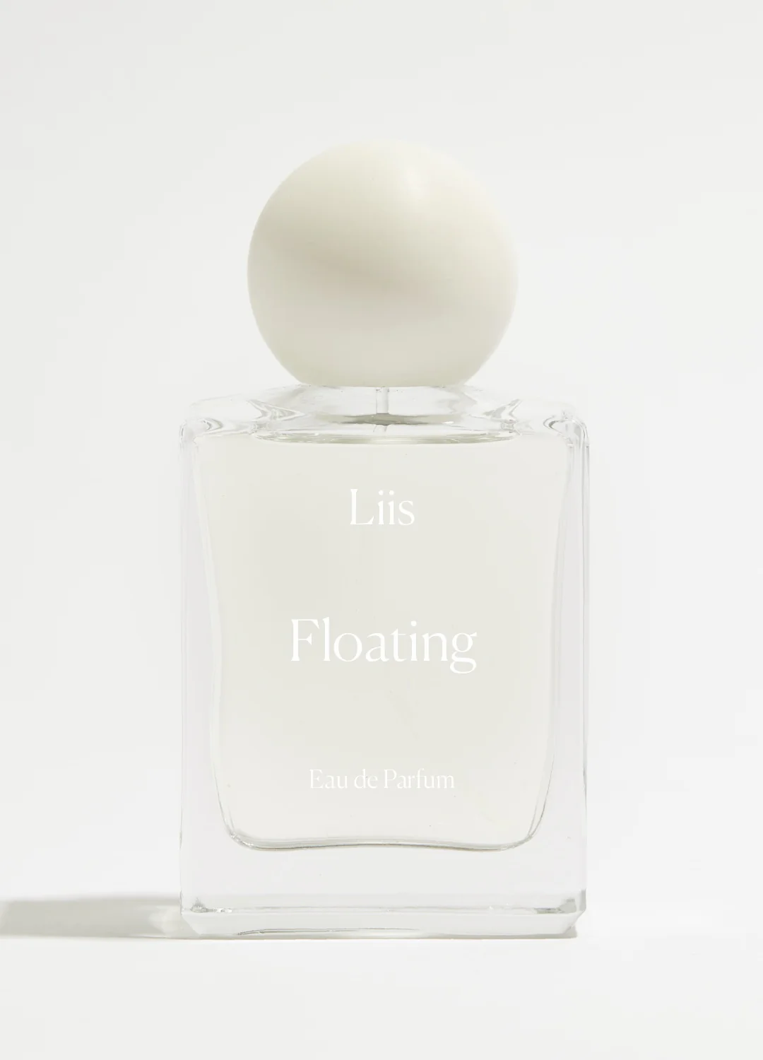 Прозорий флакон Liis Floating Eau de Parfum на світлому тлі