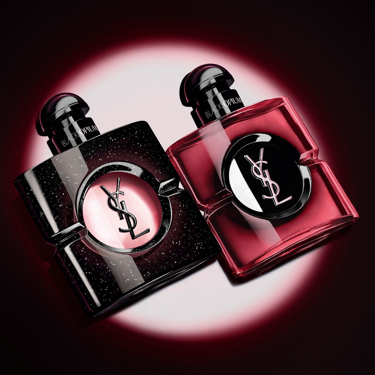 Рожевий Black Opium Pink Glaze поруч із класичним темним флаконом Black Opium