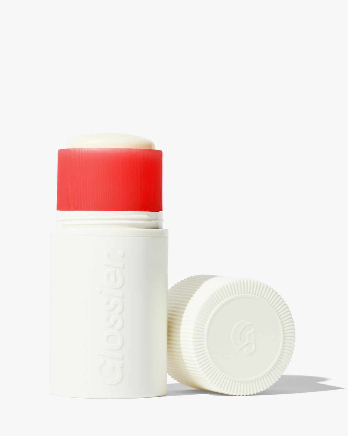 Відкритий дезодорант Glossier із червоним кільцем на білому тлі
