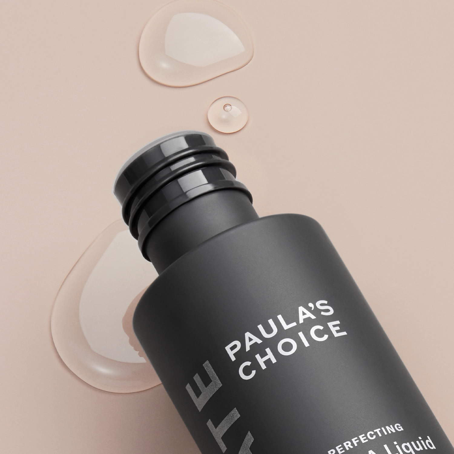 Флакон Paula’s Choice Skin Perfecting 2% BHA Liquid Exfoliant з прозорими краплями засобу