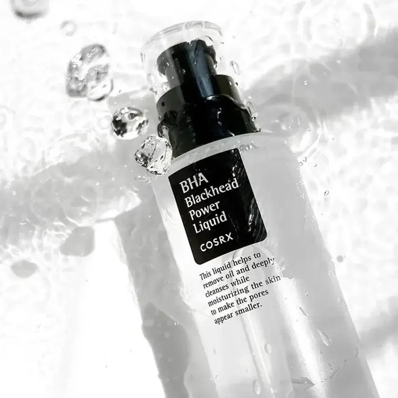 Засіб COSRX BHA Blackhead Power Liquid у флаконі з краплями води